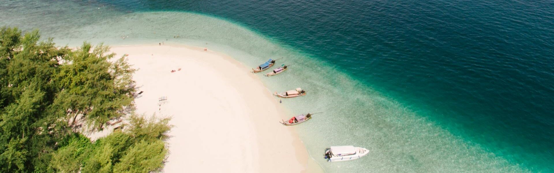 Koh Samui’s lush island scenery in Thailand on a Koh Samui Travel banner by Legend Travel Group.